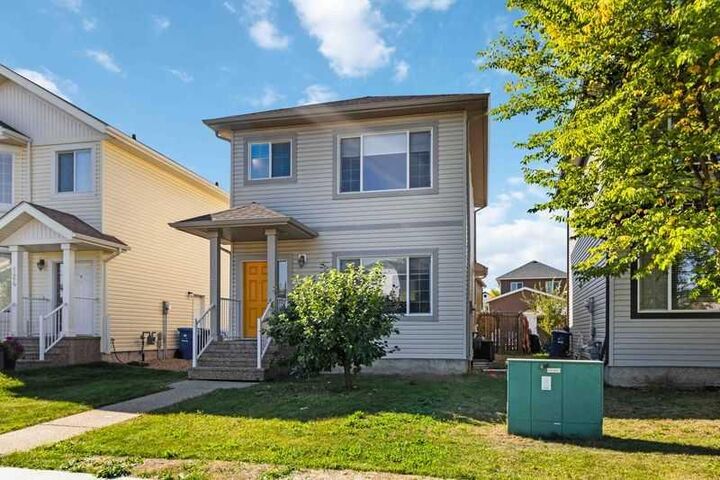 Property Photo:  128 Juniper Street  AB T9K 0M8 