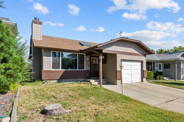 Property Photo:  12 Cedargrove Road SW  AB T2W 4T9 