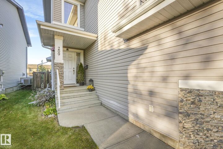 Property Photo:  209 Silverstone Crescent  AB T7Z 0E8 
