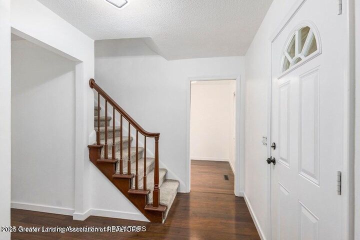 Property Photo:  1012 Grenoble Circle  MI 48917 