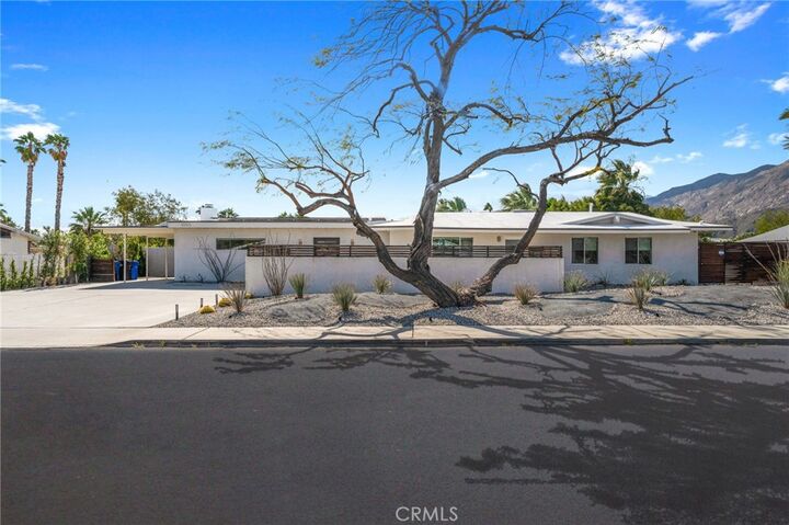 Property Photo:  1055 E Racquet Club  CA 92262 