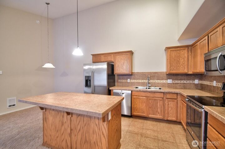 Property Photo:  1407  Evergreen Park Drive SW 301  WA 98502 