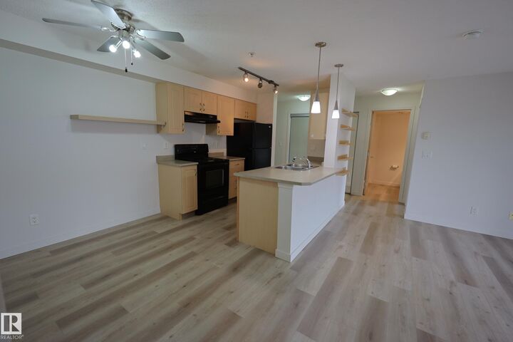 Property Photo: 13908 136 Street NW 306 AB T6V 1Y4