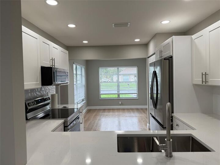 Property Photo:  6111 Rainbow Circle  FL 33463