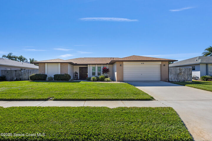 Property Photo:  419 Coach Road  FL 32937 