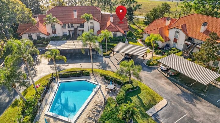 Property Photo:  2620 Enterprise Road E E14  FL 33759 