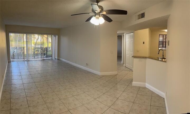Property Photo:  8701 Wiles Rd 108  FL 33067 