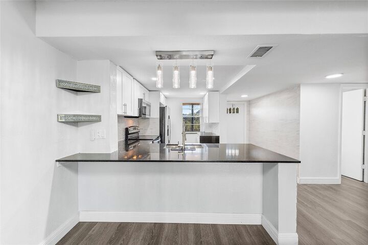 Property Photo:  10120 Boca Entrada Boulevard 409  FL 33428 