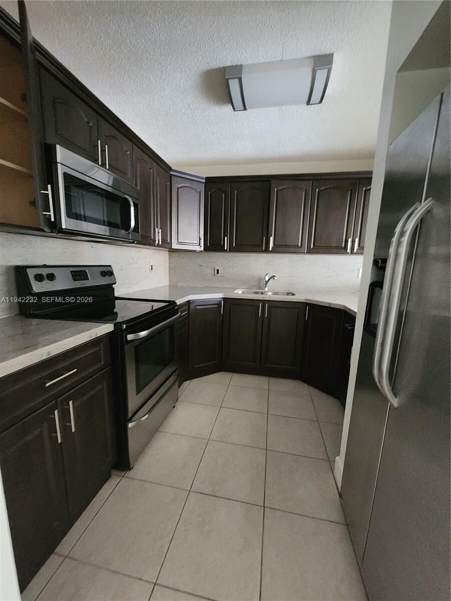 Property Photo:  7000 NW 186th St 4-314  FL 33015 