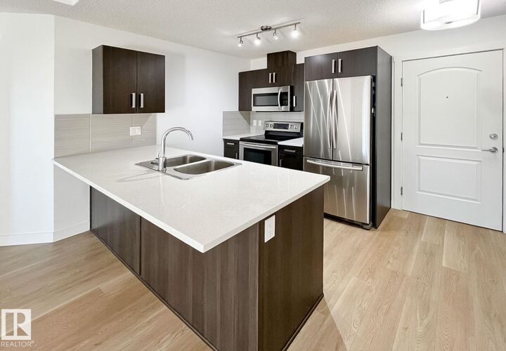 Property Photo:  667 Watt Boulevard SW 406  AB T6X 0Y2 