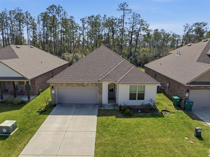 Property Photo:  1716 Sawgrass Drive  LA 70669 