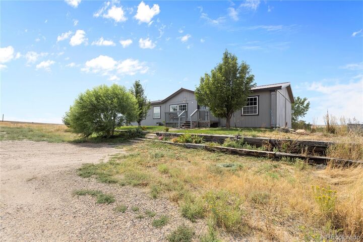 Property Photo:  47904 Dartmouth Avenue  CO 80102 