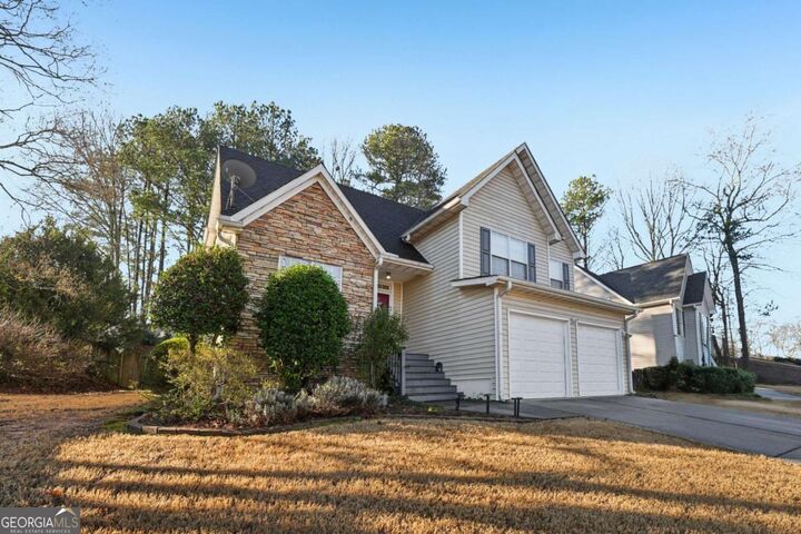Property Photo:  1620 Rushing River Way  GA 30024 
