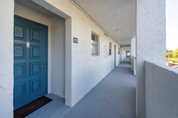 Property Photo:  6100 NW 44th Street 302  FL 33319 