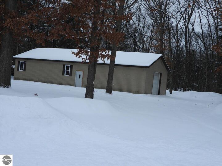 Property Photo:  7861 N Bass Lake Road  MI 49644 