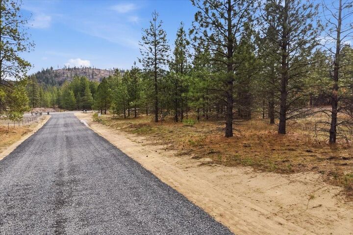 Property Photo:  65xx Whispering Pines Way Lot #1  WA 99026 