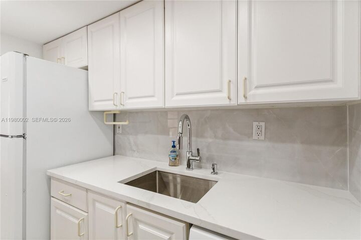 Property Photo:  17500 NW 68th Ave D1004  FL 33015 