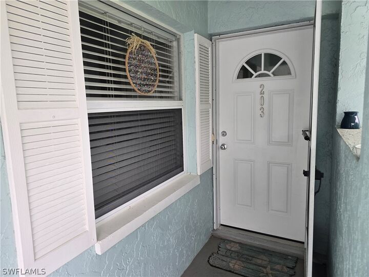 Property Photo:  5741 Whitaker Road D-203  FL 34112 