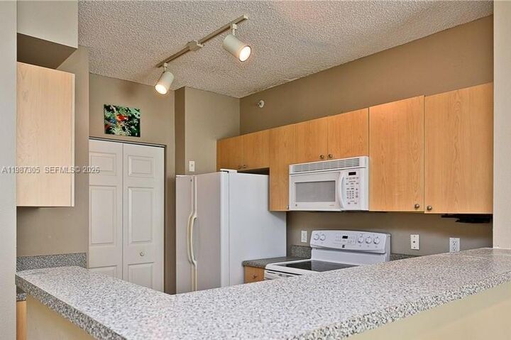 Property Photo:  8000 N Nob Hill Rd 107  FL 33321 