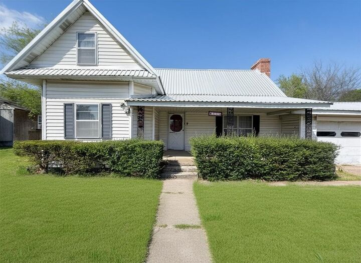 Photo de la propriété: 411 E Avenue G TX 76065