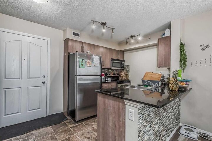 Property Photo: 7110 80 Avenue NE 408 AB T3J 0N4