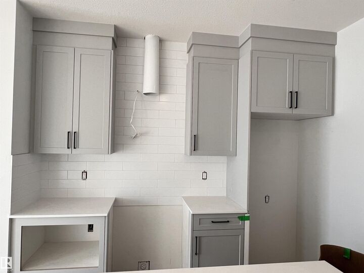 Property Photo: 5122 213A Street NW 65 AB T6M 1M6