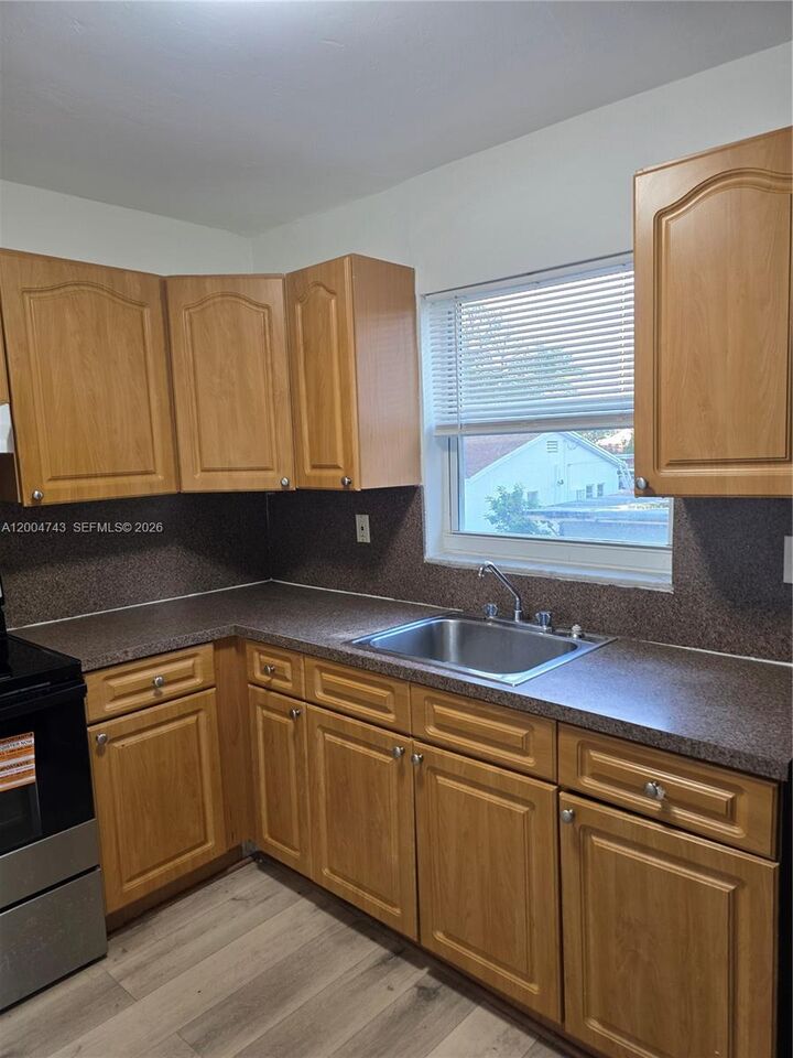 Property Photo:  1111 NW 19th Ave 205  FL 33125 