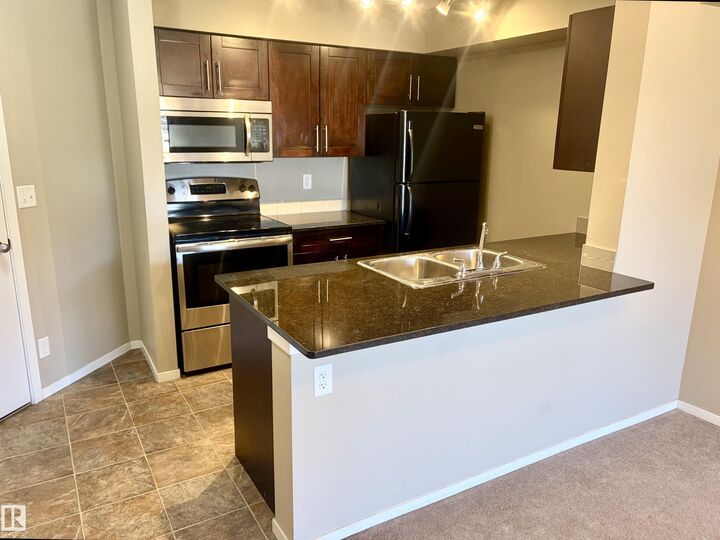 Property Photo: 3207 James Mowatt Trail SW 114 AB T6W 3L6