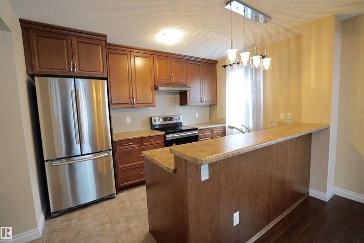 Property Photo:  12018 65 Street NW  AB T5W 4L7 