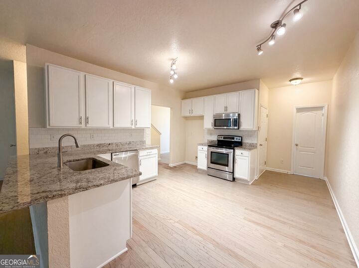 Property Photo:  5080 Windsor Forrest Lane  GA 30349 