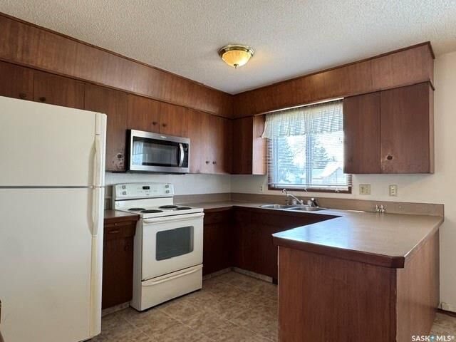 Photo de la propriété:  208 2nd Street NE  SK S0K 4V0 
