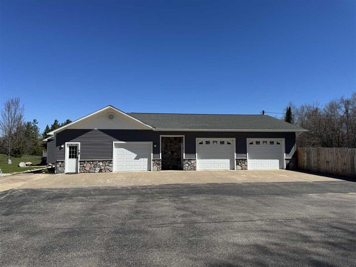 Property Photo:  6690 N U.s. 31  MI 49755 