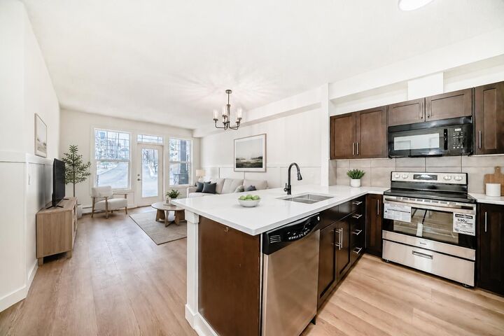 Property Photo: 22 Panatella Road NW 101 AB T3K 0V4