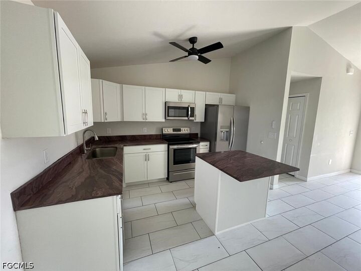 Property Photo:  1447 NW 1st Street  FL 33993 