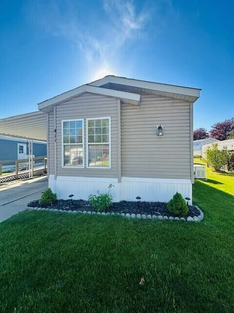 Property Photo:  411 Woodview Drive  MI 48838 
