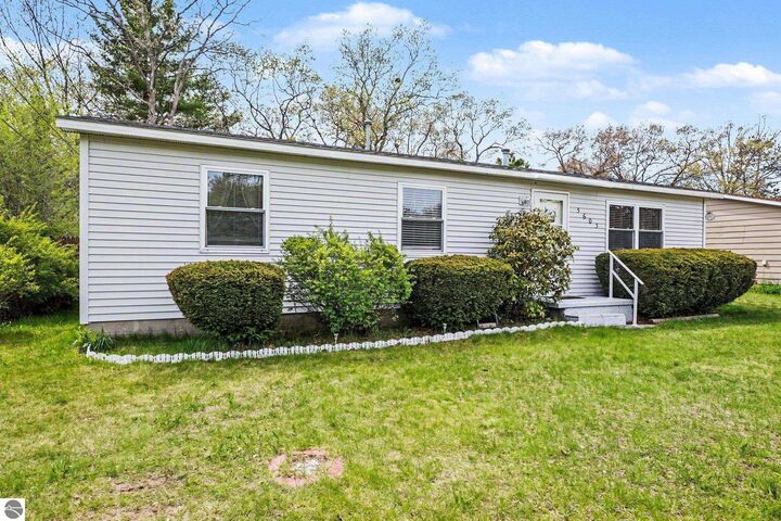 Property Photo:  5603 Cedar Lake Road  MI 48750 