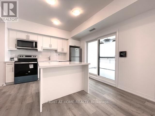 Property Photo: 15 Kneeshaw Drive 102 ON L9J 0X9