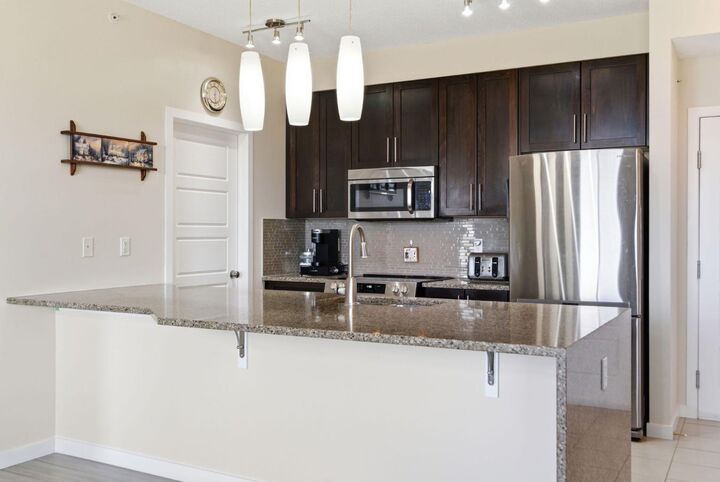 Property Photo: 207 Sunset Drive 408 AB T4C 0H8