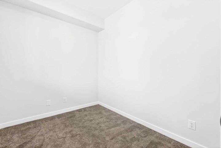 Property Photo: 40 Creekside Way SW 107 AB T2X 6E2