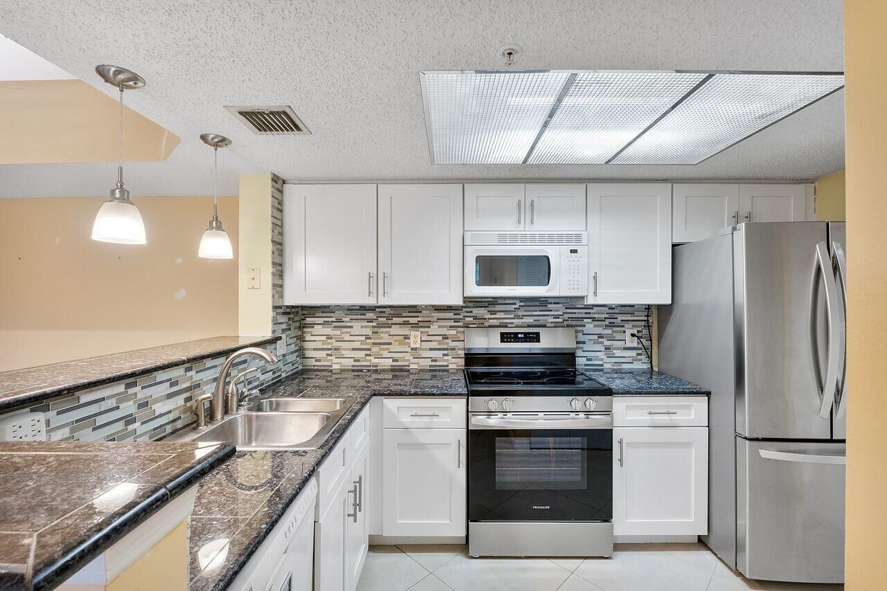 Property Photo:  5011 Wiles Road Unit 303  FL 33073 