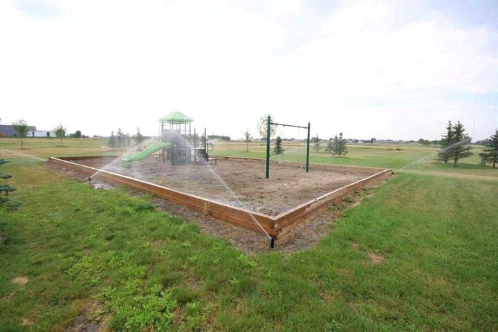 Property Photo: 2 Meadows Way AB T1G 2A2
