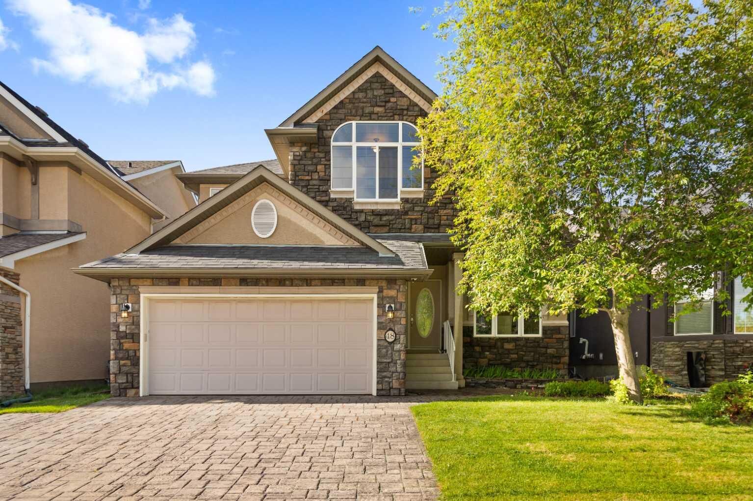 Property Photo:  48 Strathlea Close SW  AB T3H 5C6 