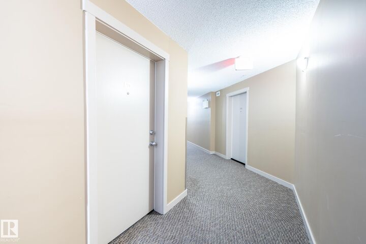 Property Photo: 18122 77 Street NW 108 AB T5Z 0N7