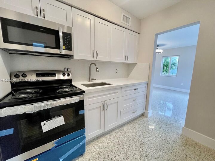 Property Photo: 174 E 5th St 1 FL 33010