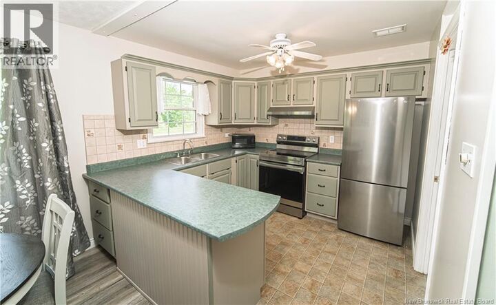 Property Photo:  519 Gardiner Street  NB E2V 1G5 