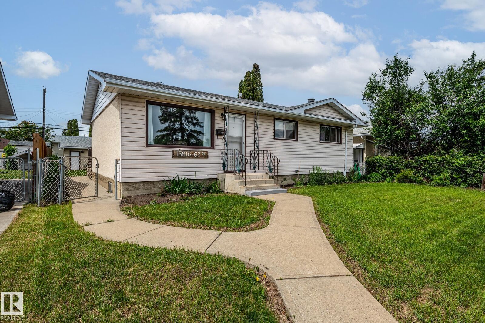 Property Photo: 13816 62 Street NW AB T5A 1P7