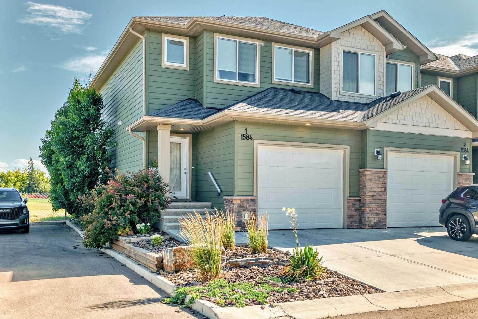 Property Photo:  1584 Stafford Drive N 1  AB T1H 2C5 