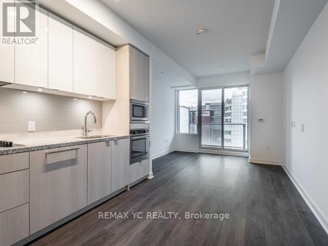 Property Photo: 115 Blue Jays Way 2610 ON M5V 0N4