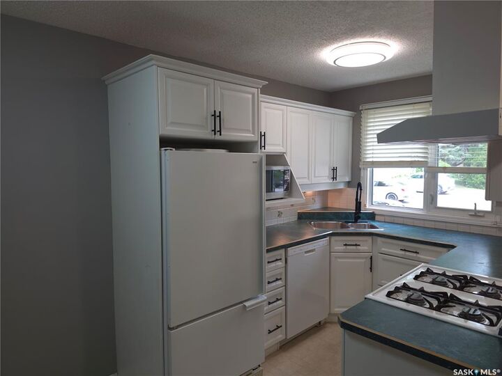 Property Photo:  1128 McKercher Drive 18  SK S7H 4Y7 