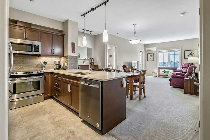 Property Photo:  310 McKenzie Towne Gate SE 3405  AB T2Z 1J4 